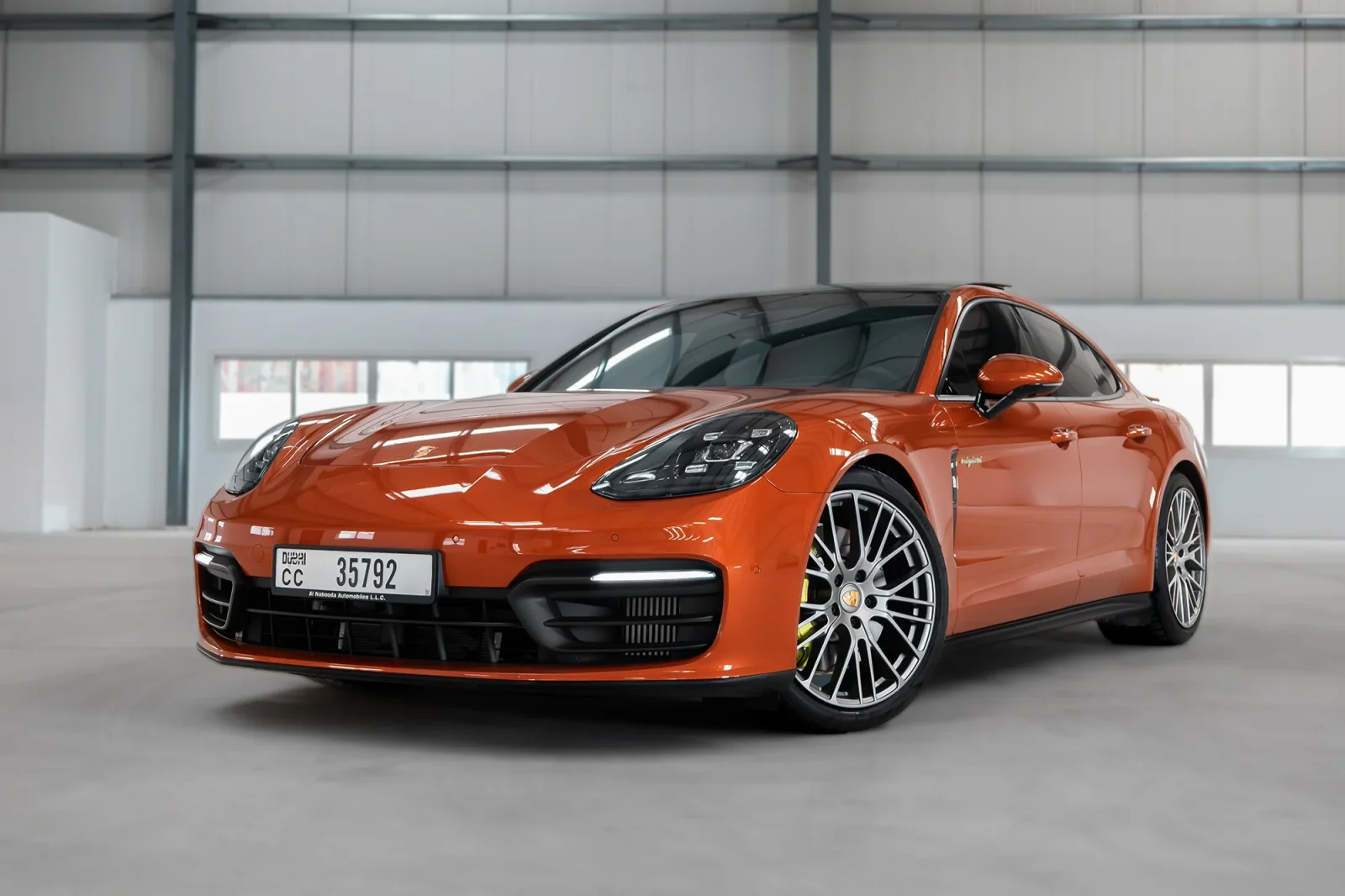 Rent Porsche Panamera 4 Hybrid Orange 2023 in Dubai