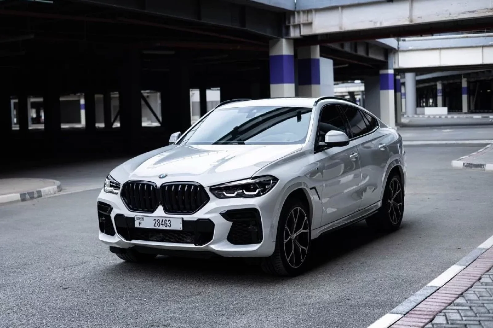 Rent BMW X6M 40I Sport White 2023 in Dubai